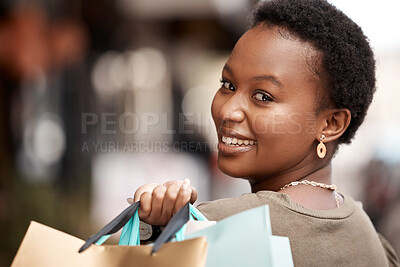Buy stock photo Happy, sale and portrait of black woman with shopping bag for luxury giveaway, discount and deal. Smile, customer and person with designer clothes for boutique commerce, retail and gift in Nigeria