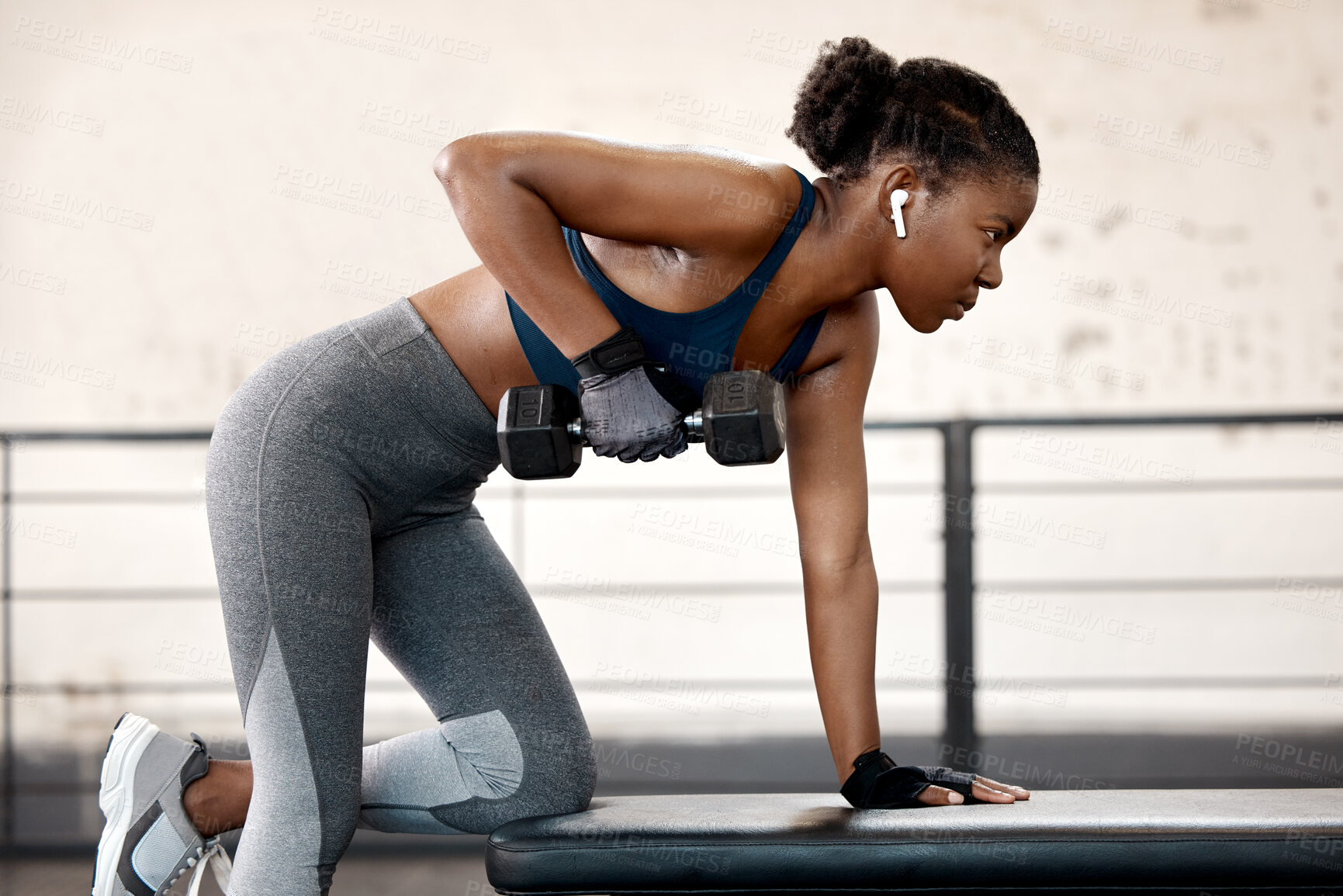 Buy stock photo Fitness, dumbbell and female athlete doing a exercise in gym for strength, arm and body training. Sports, challenge and black woman doing muscle workout with weights for motivation in sport center.