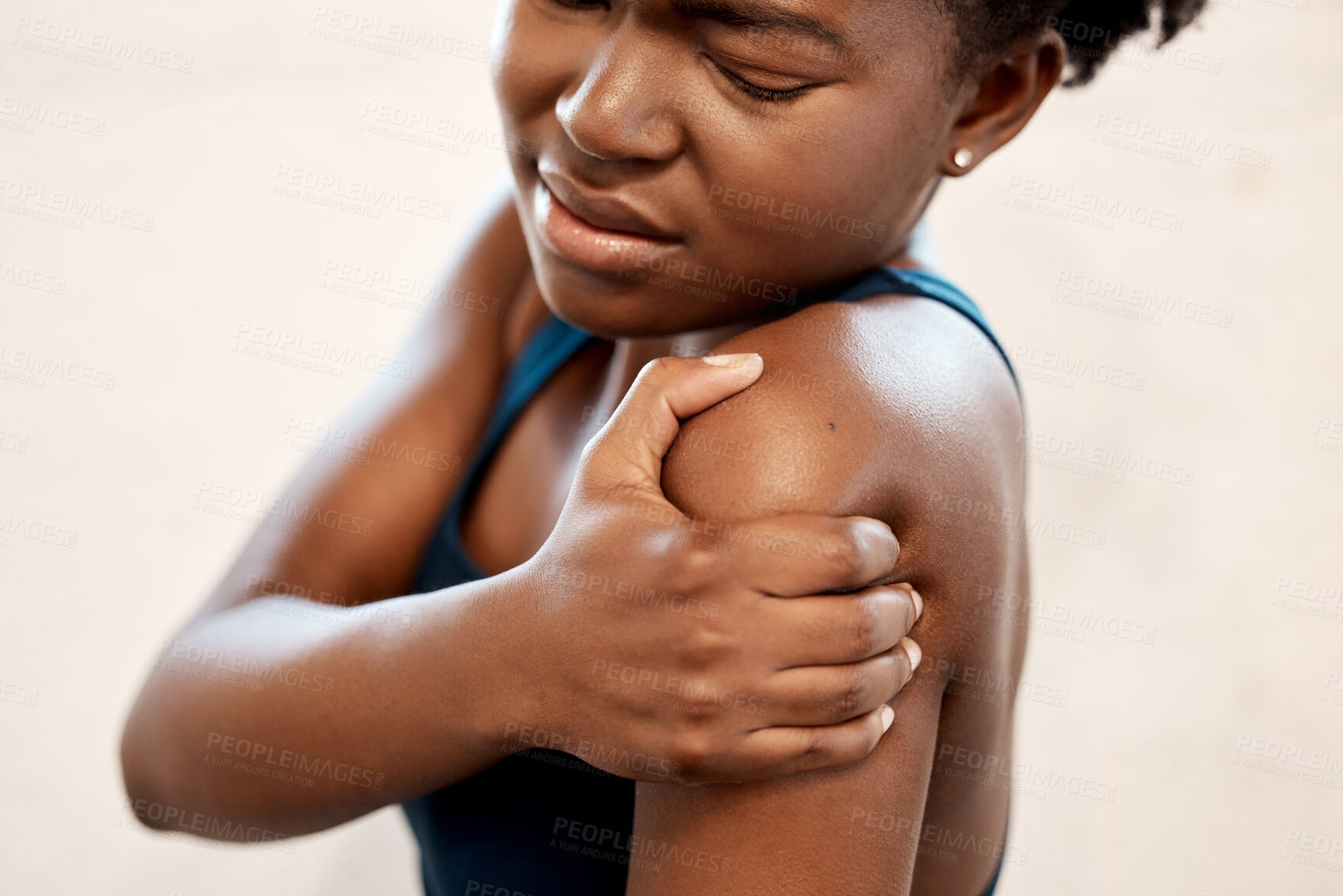 Buy stock photo Fitness, injury and black woman with shoulder pain during exercise at sports studio, massage and relief. Gym, hand on arm muscle for support and African girl with body ache during training or workout