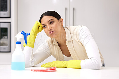 Buy stock photo Woman, cleaner is tired and sad or bored, unhappy with housework and housekeeping with chemical detergent spray. Spring cleaning, exhausted with female person in kitchen and housekeeper with burnout