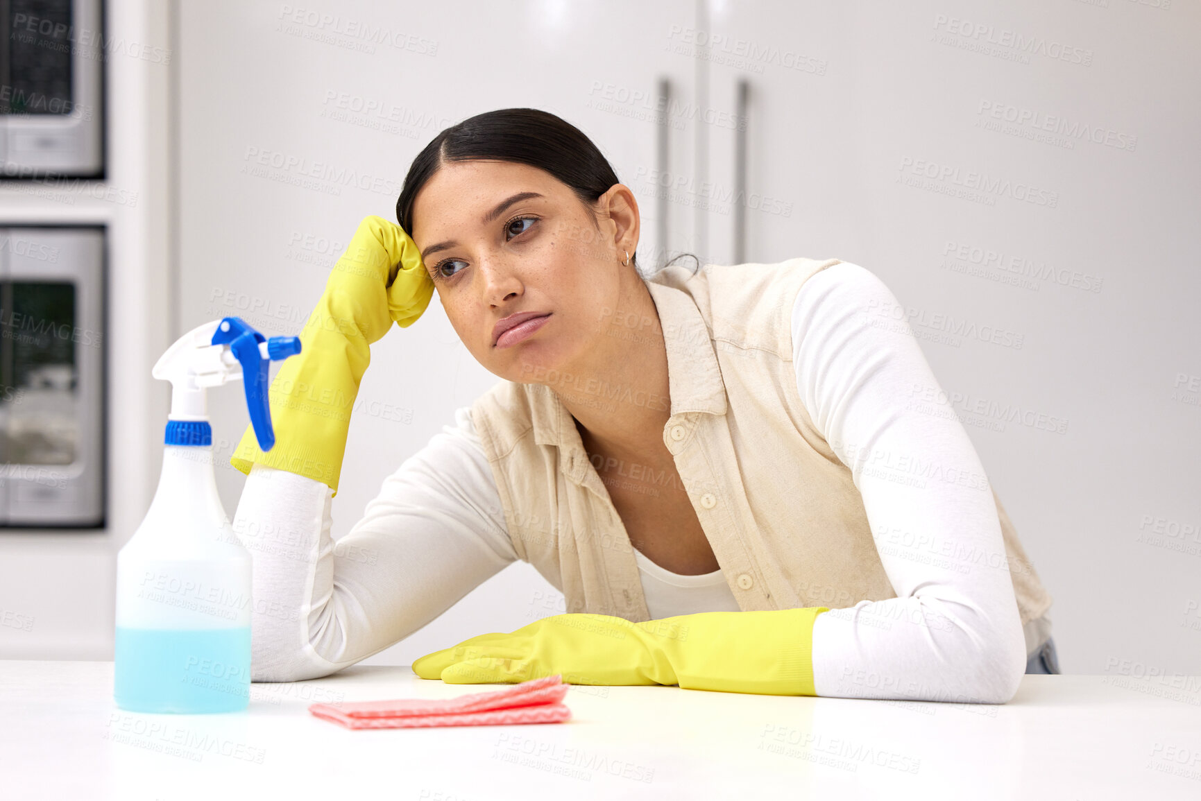 Buy stock photo Woman, cleaner is tired and sad or bored, unhappy with housework and housekeeping with chemical detergent spray. Spring cleaning, exhausted with female person in kitchen and housekeeper with burnout