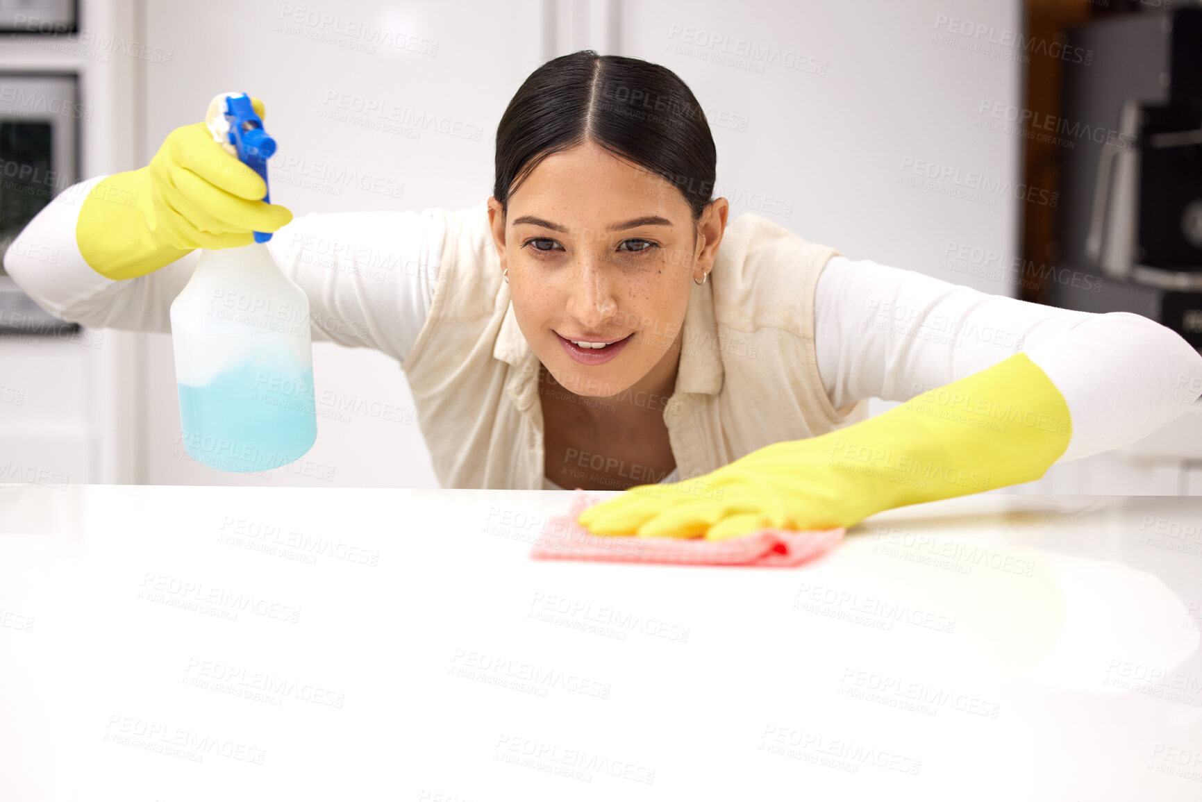 Buy stock photo Woman, clean table with chemical detergent spray and cloth with focus and wipe dirt. Housekeeping, female cleaner concentrate at home with hygiene, cleaning with bottle and disinfecting surface
