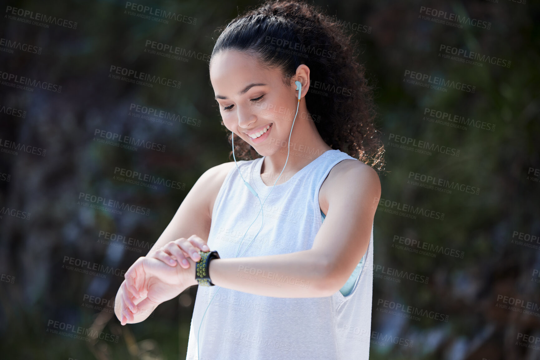 Buy stock photo Smart watch, fitness and woman in nature for exercise, training and workout while listening to music. Sports, motivation and happy female person check time for heart rate, wellness and performance