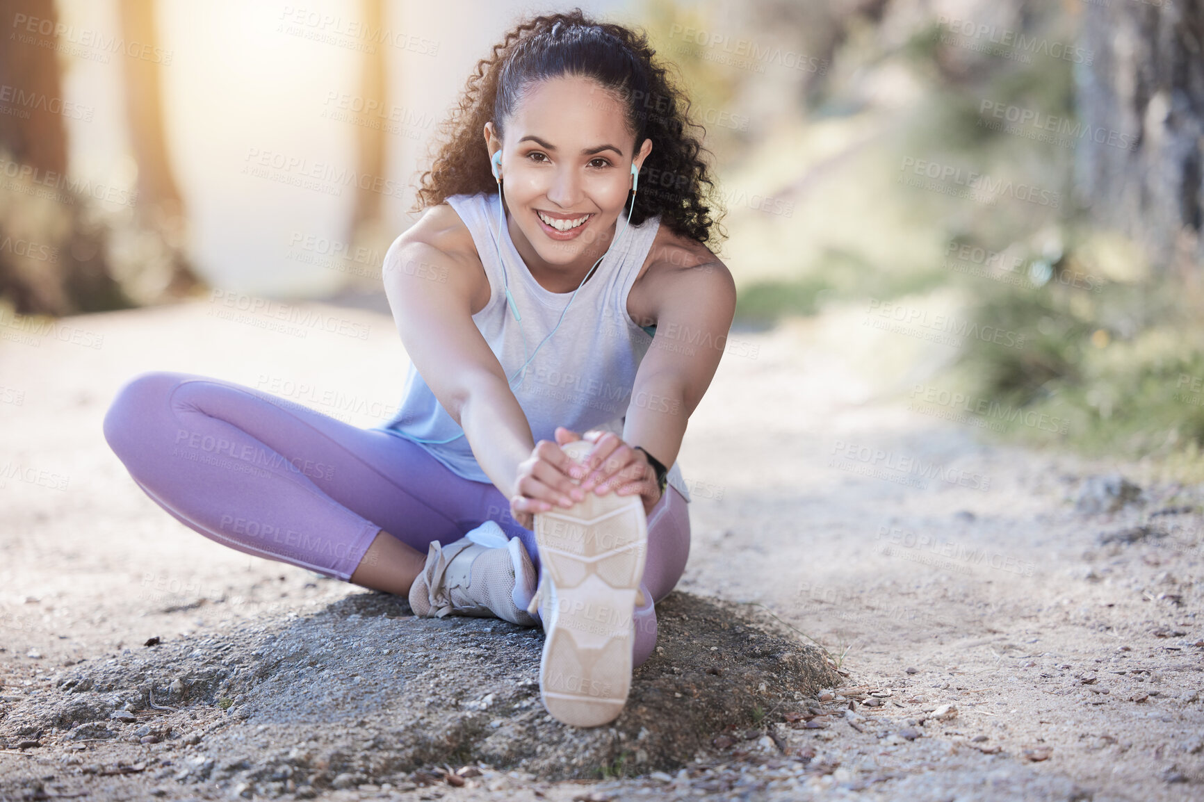 Buy stock photo Happy woman, portrait smile and stretching body in nature running, exercise or workout outdoors. Fit, active or sporty female person smiling in warm up stretch for exercising or training in forest