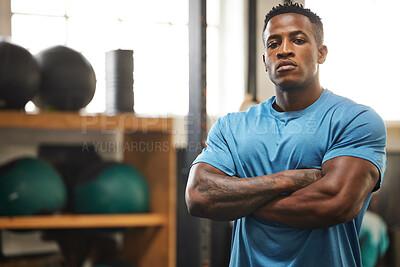 Buy stock photo Personal trainer, man and arms crossed in portrait with equipment, confidence and pride for fit, wellness and health. Male person, African and strong in gym for muscles, sports and bodybuilding