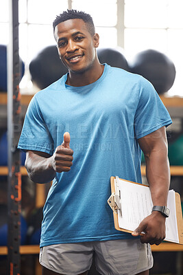 Buy stock photo Thumbs up, portrait and fitness man in gym, clipboard and checklist for workout results, progress and like, yes or okay hand. African person, athlete or bodybuilder paperwork and thank you sign