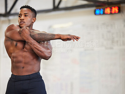 Buy stock photo Shirtless black man, stretching arms and fitness in gym with muscle, strong and abs with workout and mockup space. Focus, serious male athlete and bodybuilder, warm up and ready for exercise