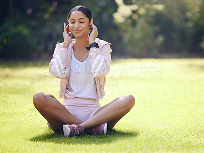 Buy stock photo Relax, woman and music for fitness in park, resting and meditate with smile as routine. Audio, female person and exercise for healthy body, wellness and mental health with headset for sport in nature