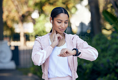 Buy stock photo Fitness, woman and pulse rate outdoor after running, workout and exercise with smile as routine. Runner, female person and smart watch for checking endurance, wellness and mental health in park