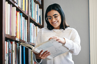Buy stock photo Young, female student and book from library on campus to prepare with research or information for exam or lecture. Happy, woman and reading or learning for knowledge with novel or textbook for future
