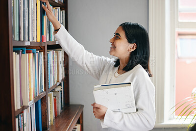 Buy stock photo Studying, woman and student in library, books and school with education, smile and bookshelf. Happy person, college and girl with novel, literature and university with scholarship and knowledge