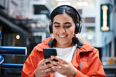 Buy stock photo Shot of a young female student using a phone at college