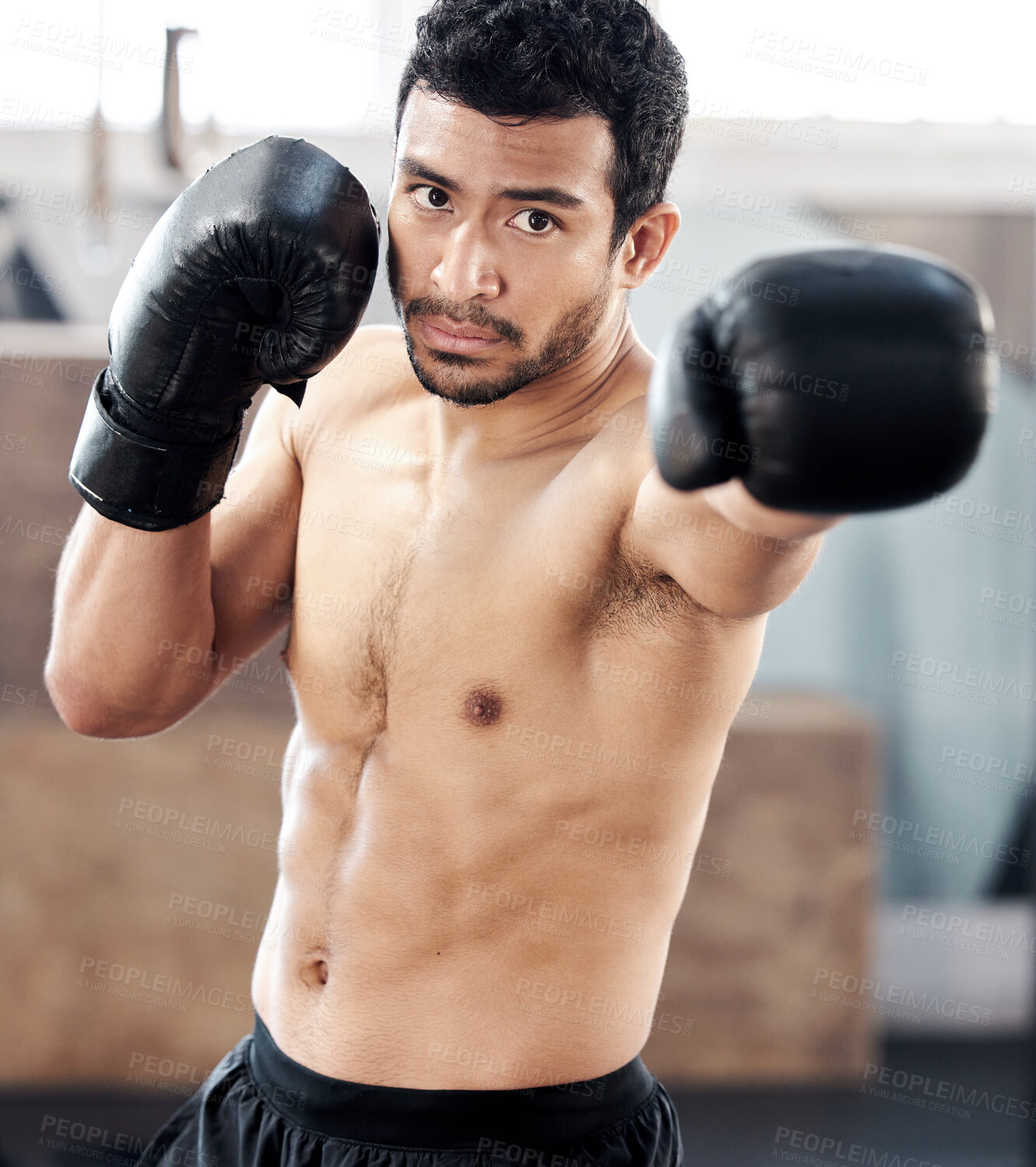 Buy stock photo Boxer, portrait and serious man in gym for punch, exercise and training for fight. Face, boxing and male athlete, fighter or sports person workout, fitness and practice for martial arts challenge.