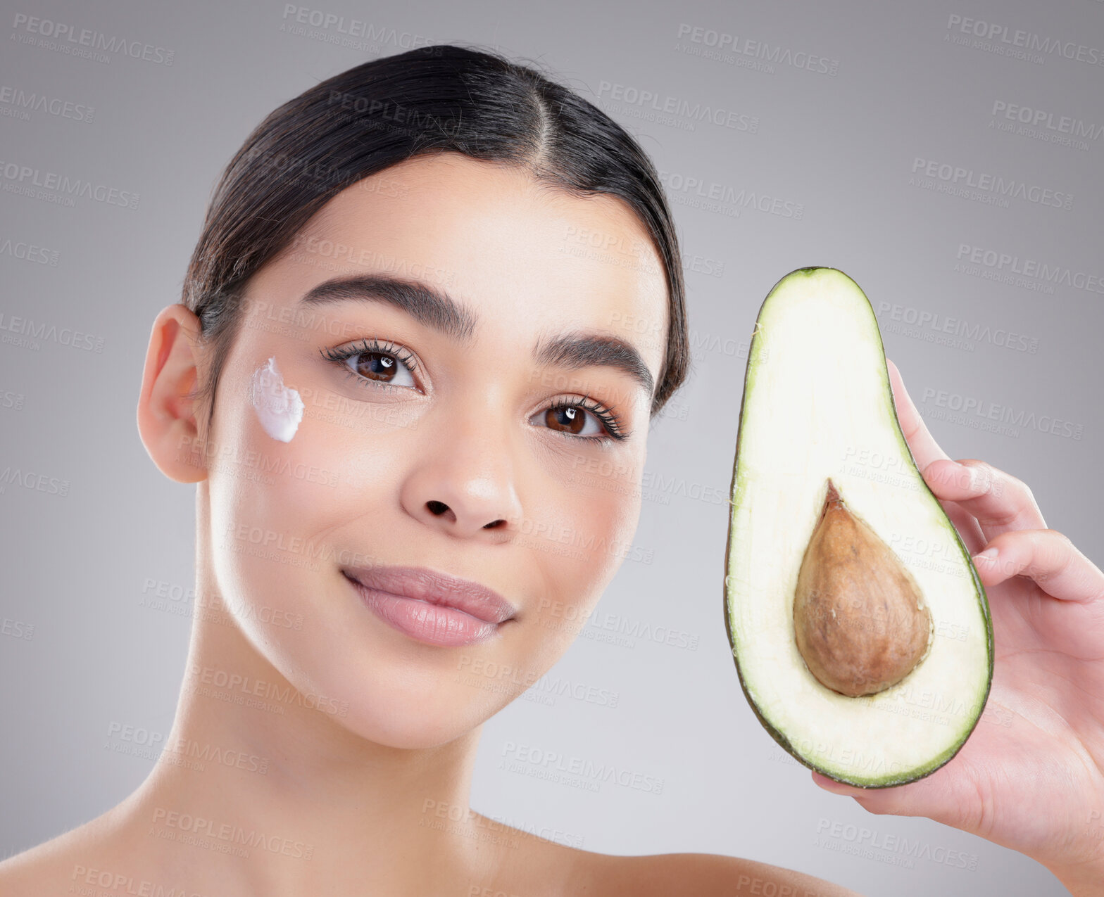 Buy stock photo Avocado, beauty and lotion with portrait of woman in studio on gray background for diet, health or nutrition. Cream, food or skincare and happy model with fresh produce for natural or organic detox