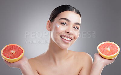 Buy stock photo Grapefruit, lotion and skincare with portrait of woman in studio on gray background for diet, health or nutrition. Beauty, cream or fruit and happy model with fresh produce for organic detox