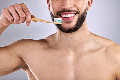 Buy stock photo Toothpaste, man and brush in studio background with smile for oral hygiene, clean mouth and medical wellness. Male person, fresh and happy isolated for dental care, grooming and cavity prevention 