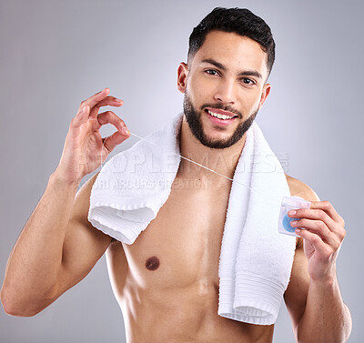 Buy stock photo Dental floss, smile and portrait of man in studio with clean, health and plaque removal routine. Happy, cosmetic and male person with oral hygiene product for mouth treatment by gray background.