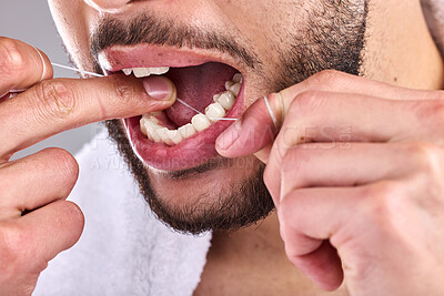 Buy stock photo Mouth, dental and man floss teeth in studio isolated on a background for healthy hygiene. Tooth, flossing product and closeup of male model cleaning for oral wellness, fresh breath and gums.