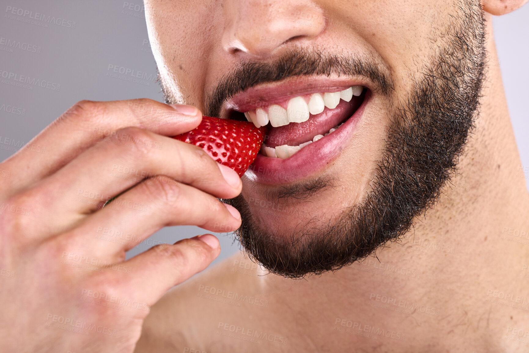 Buy stock photo Health, mouth and strawberry with person eating fruit closeup in studio on gray background. Diet, nutrition and wellness with model biting organic, natural or raw food for detox, hunger or vitamin c