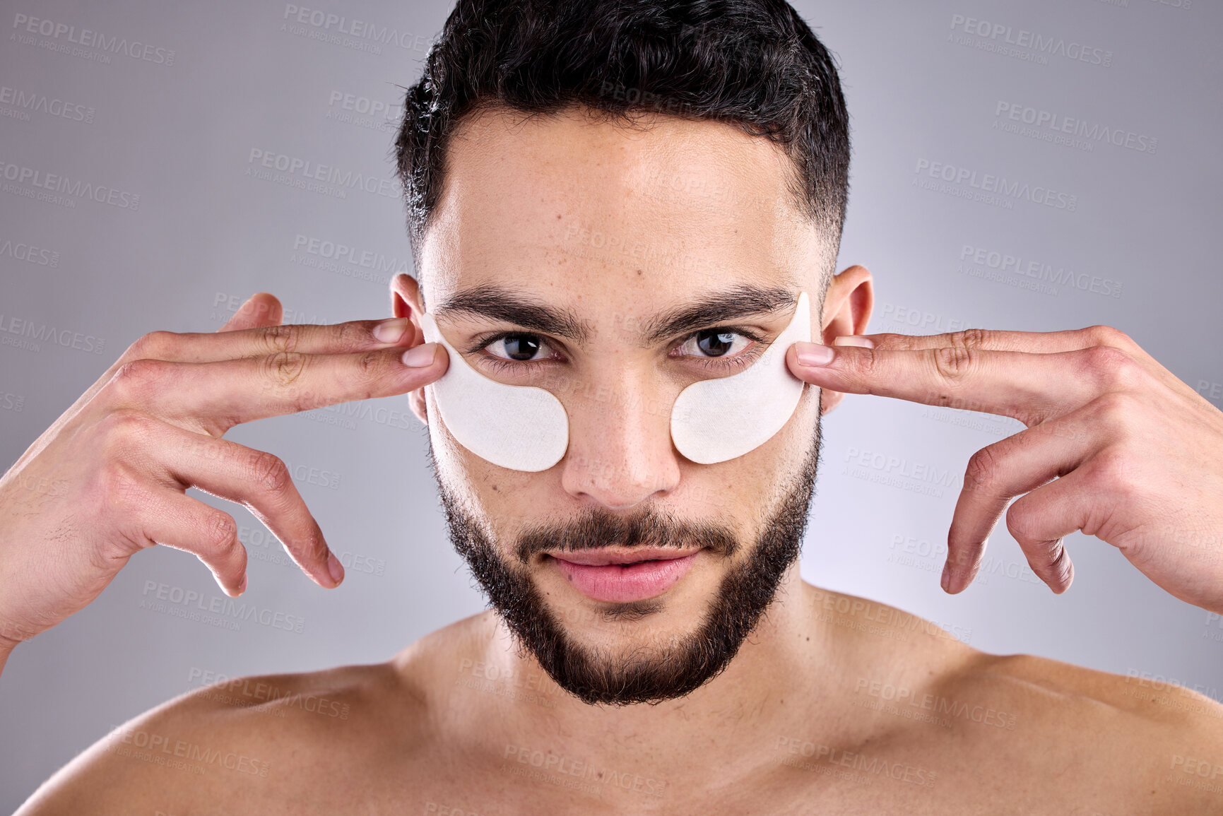 Buy stock photo Beauty, eye mask and portrait of man in studio for antiaging skincare treatment or wellness. Aesthetic, dermatology or face of confident model and patch on skin for change, collagen or transformation