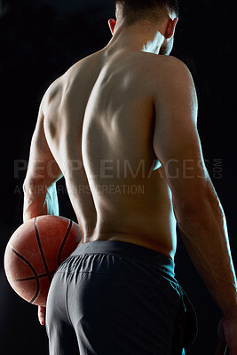 Buy stock photo Man, fitness and back with basketball for sport game, match or challenge in studio on a black background. Rear view of male person, athlete or player with ball for exercise, training or wellness