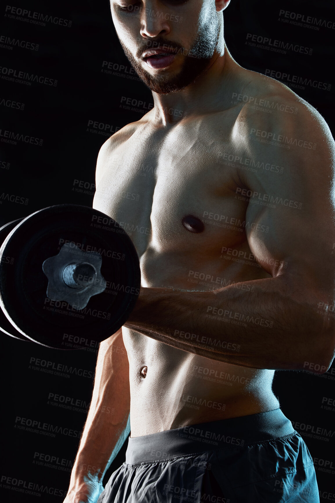 Buy stock photo Healthy, man or athlete lifting dumbbell flexing in dark studio background for fitness, workout and wellness. Topless, bodybuilder or male person isolated and thinking of training and exercise