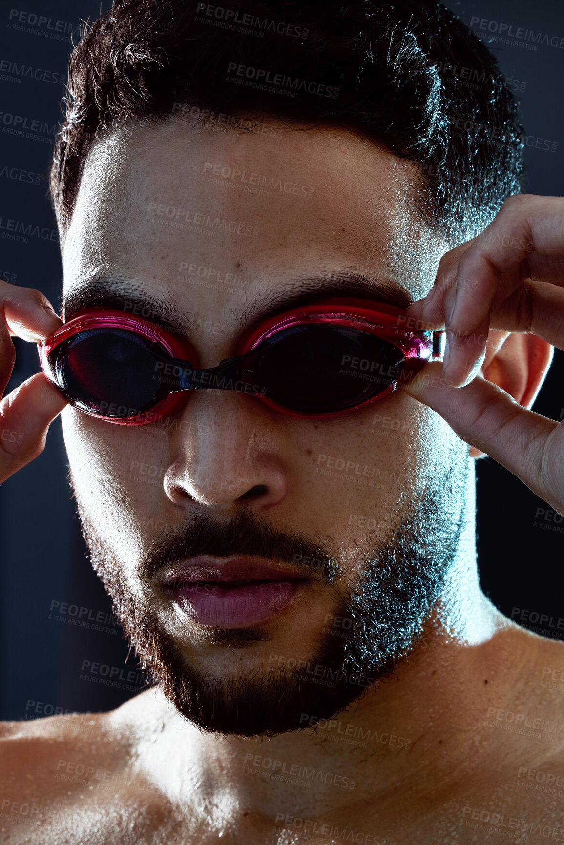 Buy stock photo Goggles, swimmer or portrait of man ready for race, exercise or training on dark background in studio. Start, champion or proud athlete in swimming workout for fitness practice, development or sports