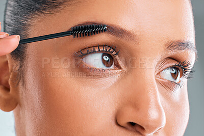 Buy stock photo Beauty, zoom and woman with mascara brush in studio for apply cosmetics, makeup or lashes on white background. Closeup, salon and face of female model with product for eyelashes, grooming or glamour