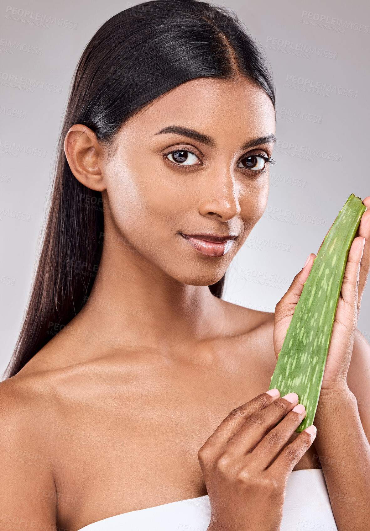 Buy stock photo Portrait, woman and aloe for skincare in studio with natural organic product for facial cleaning, cosmetic and beauty with healing benefit. Cactus, plant and serum glow results on grey background