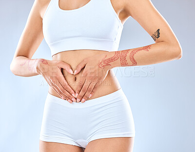 Buy stock photo Health, stomach and heart for girl in studio, digestion and nutrition with mockup. Hands, female model and abdomen detox for self care, benefits and colon wellness by white background with backdrop