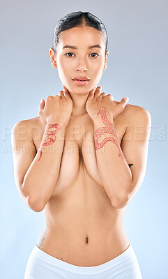 Buy stock photo Portrait of an attractive young woman  posing topless against a grey background