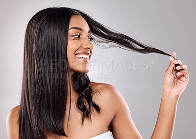 Buy stock photo Smile, beauty and hair care of Indian woman in studio for wellness isolated on white background. Touch, hairstyle and happy model in makeup cosmetics at hairdresser salon for glow, health or shine