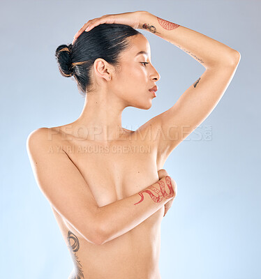 Buy stock photo Shot  of an attractive young woman  posing topless against a grey background