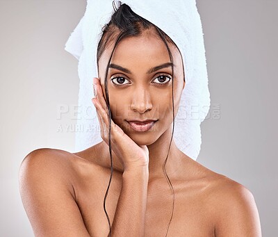 Buy stock photo Shot of a beautiful young woman posing against a grey background