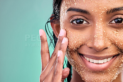 Buy stock photo Studio portrait, woman and salt scrub for skincare with wellness, exfoliation and skin glow for facial. Indian girl, dermatology and sugar texture for face mask with vegan cosmetic by blue background