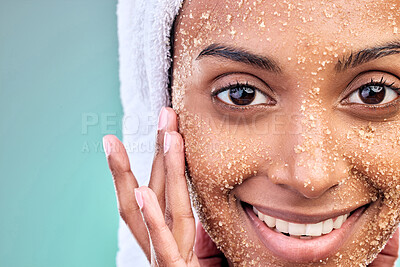 Buy stock photo Woman face, beauty and salt scrub with skin care, exfoliation and wellness or dermatology in studio. Portrait of model with sugar texture for cosmetics and makeup removal or facial on blue background