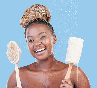 Buy stock photo Studio portrait of an attractive young woman showering against a blue background