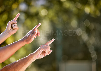 Buy stock photo Pointing, hands and outdoor together for community, workshop and teamwork or collaboration. Support, group or people in nature fingers to the sky for sustainable growth, direction and communication