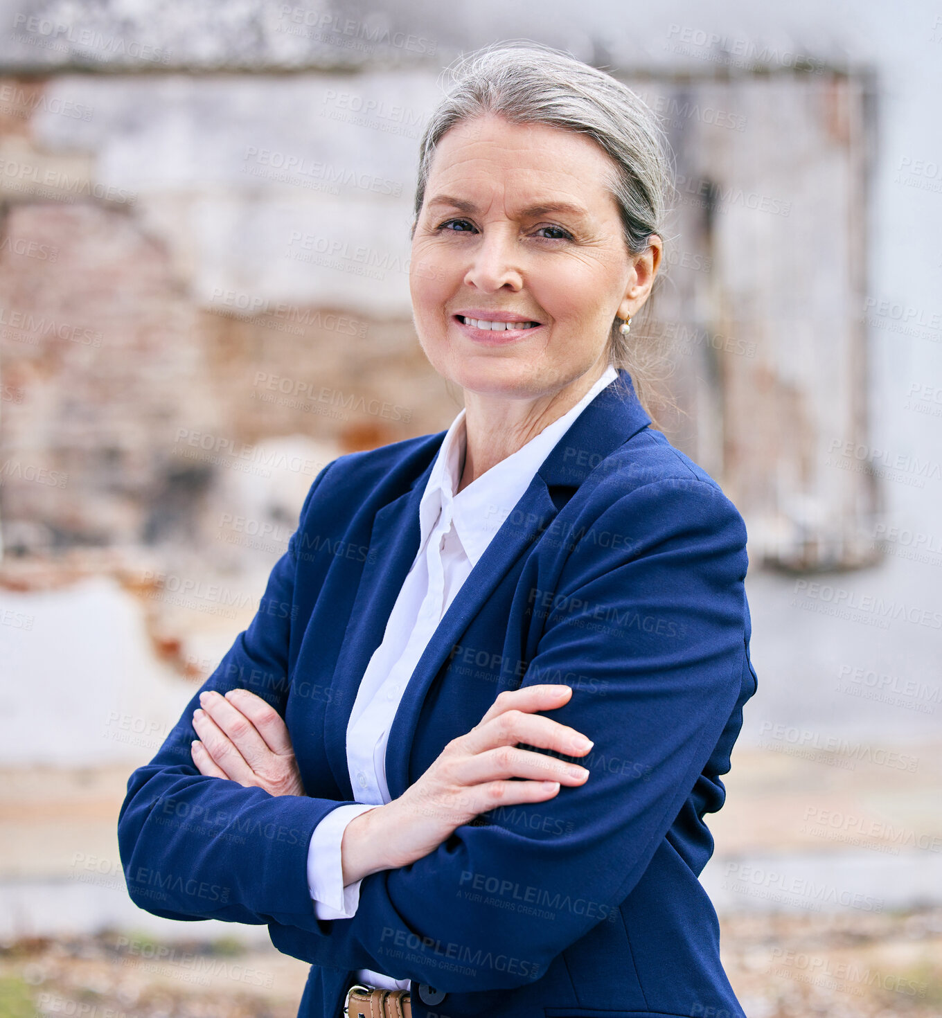 Buy stock photo Happy and mature businesswoman at construction site with arms crossed for building project and property. Smile, person and realtor portrait with confidence, pride and ambition for house renovation