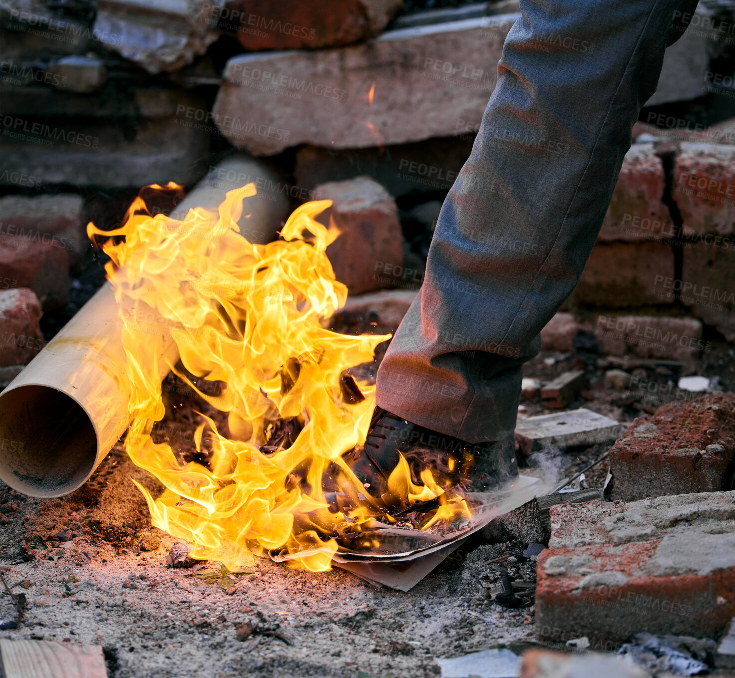 Buy stock photo Leg, outdoor and foot of person with fire for accident or emergency, smoke and danger risk with paper ash. Orange flame, mafia and shoe of man for arson crime with destroy evidence and burn documents