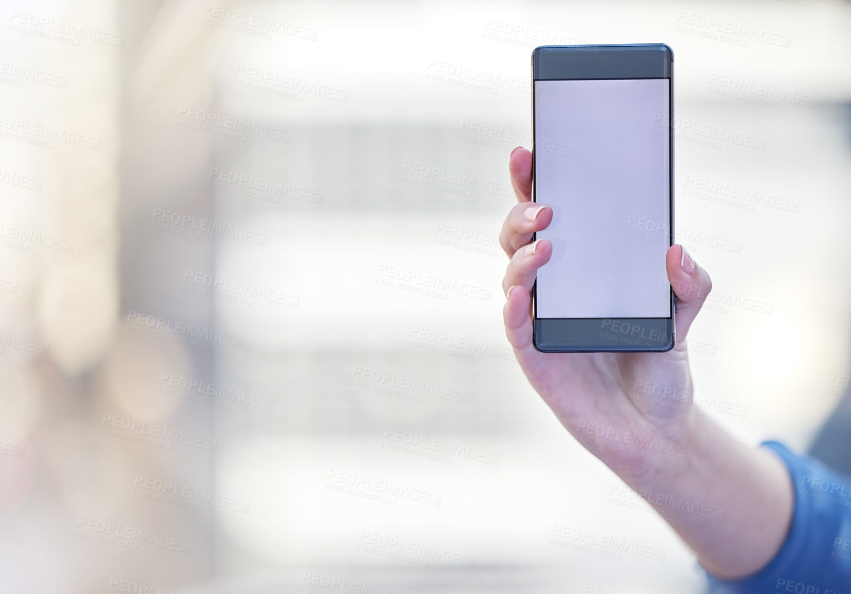 Buy stock photo Shot of a businesswoman holding a smartphone showing its screen