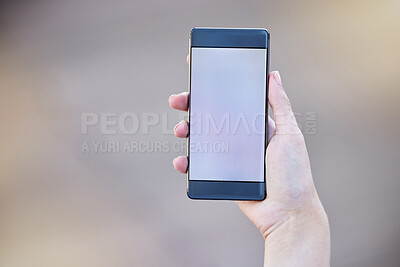 Buy stock photo Shot of a businesswoman holding a smartphone showing its screen