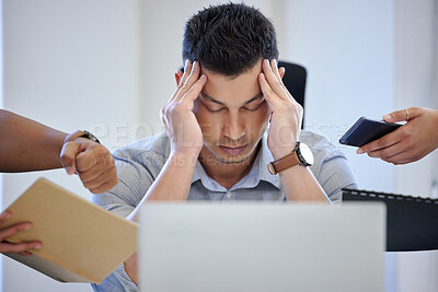 Buy stock photo Shot of a mature businessman looking overwhelmed in a stressful environment at work