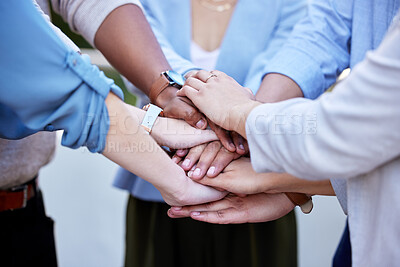 Buy stock photo Shot of a group of business people with their hands stacked