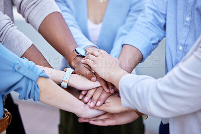 Buy stock photo Shot of a group of business people with their hands stacked