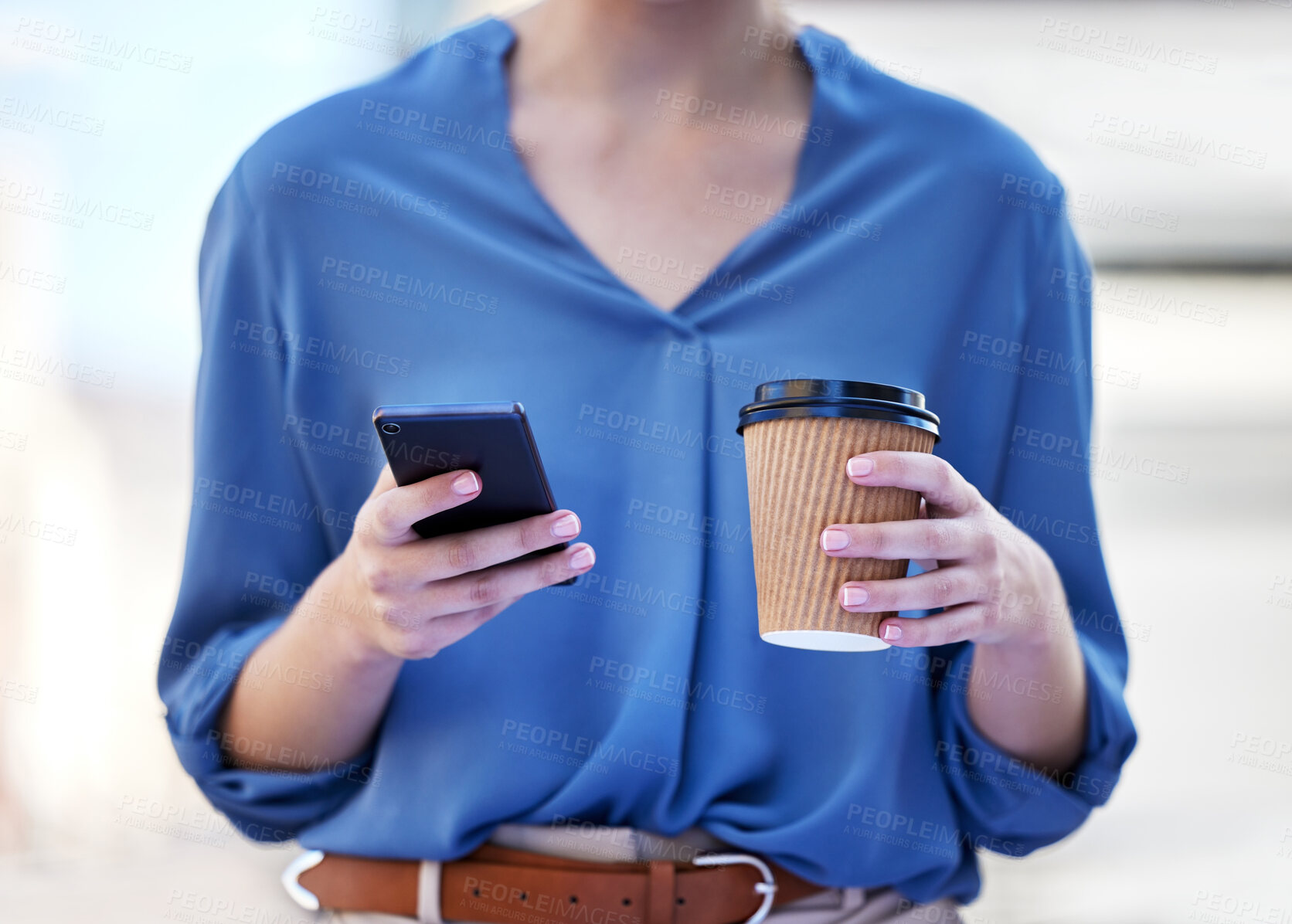 Buy stock photo Shot of a businesswoman drinking a cup coffee while using her smartphone