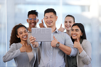 Buy stock photo Shot of a group of young businesspeople taking selfies with a digital tablet and showing thumbs up in a modern office