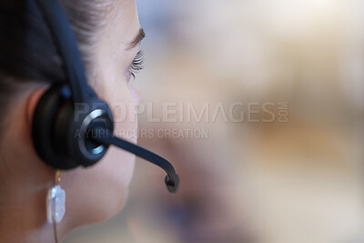 Buy stock photo Closeup shot of a young call centre agent working in an office