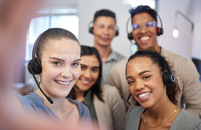 Buy stock photo Portrait of a group of call centre agents taking selfies in an office