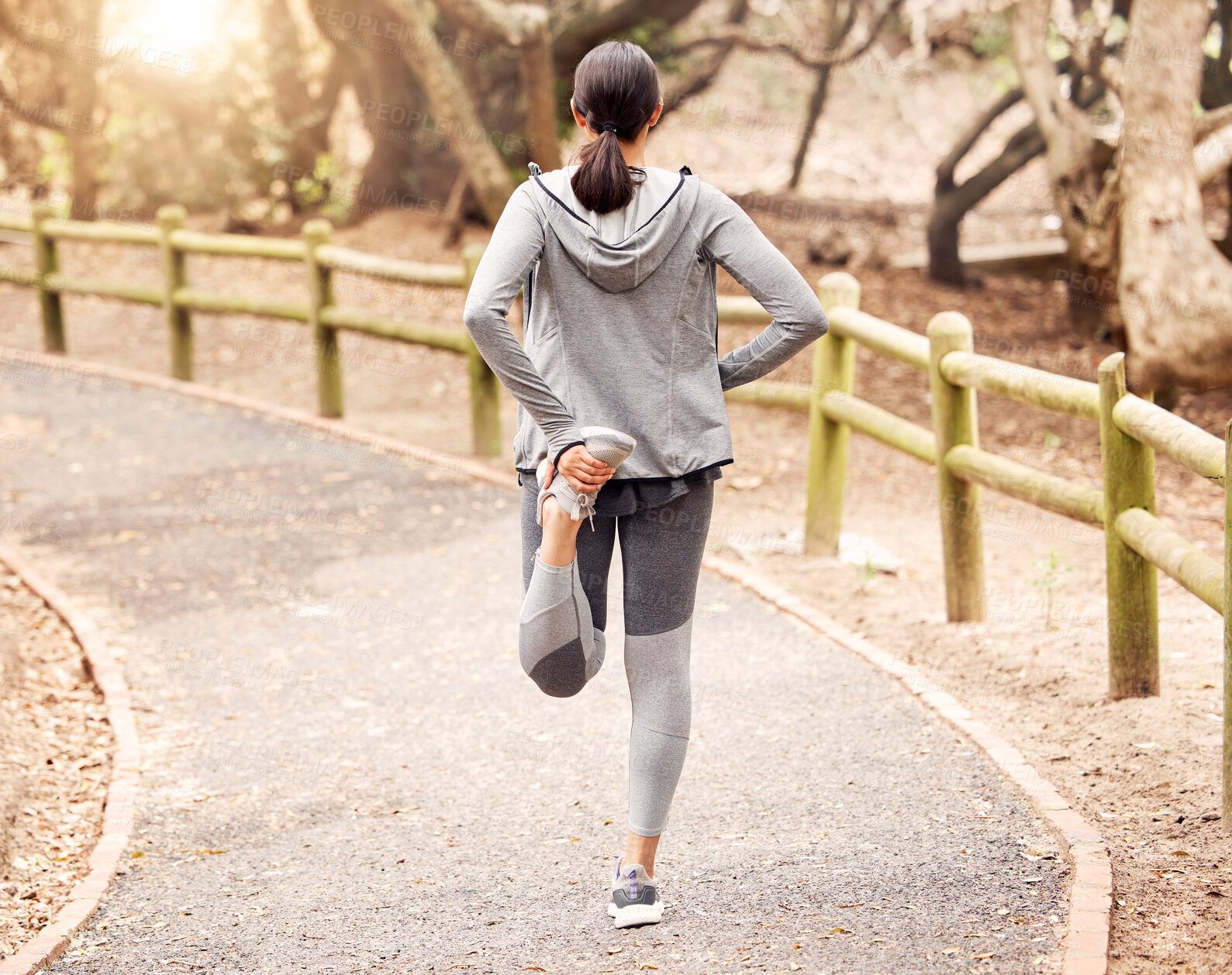 Buy stock photo Woman, stretching leg and ready for exercise in outdoor, fitness and preparation for running. Female person, back and warm up for workout in park or nature, flexible and muscle relief for training